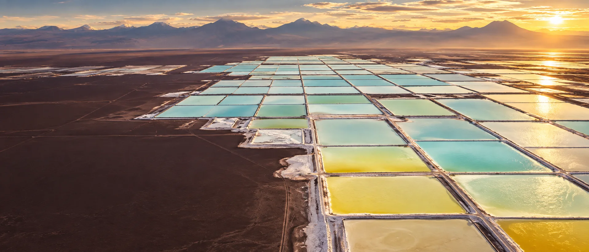 Conceptual aerial visualization of lithium-brine evaporation ponds in Chile's Salar de Atacama